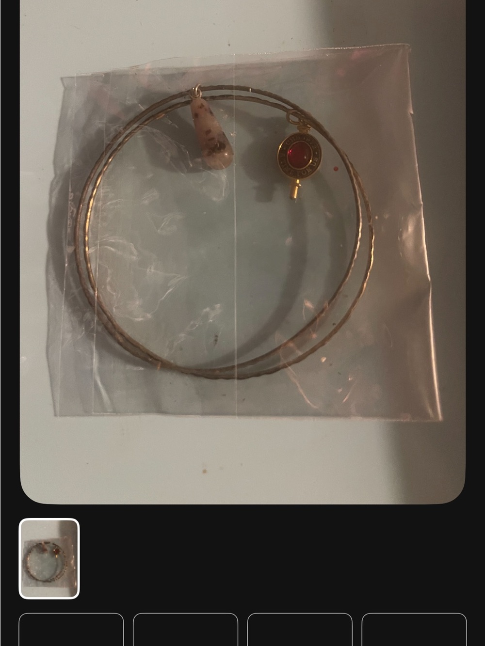 Gold Tone Hoop Bracelet with Beige Stone and Red Accent Charm